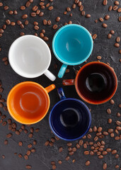 Obraz na płótnie Canvas coffee cup assortment top view collection, on rustic surface with coffee beans spoon and napkin