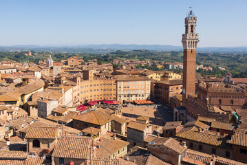 Fototapeta premium Top view of Piazza del Campo and the rooftops of Siena with detail of the bell tower