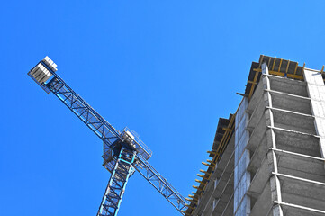 Crane and highrise construction site