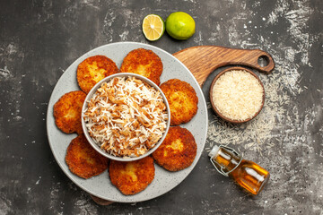 top view tasty fried cutlets with cooked rice on dark background meat rissole dish