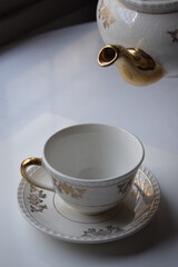 Tea hour, drinking tea, cup of tea with teapot