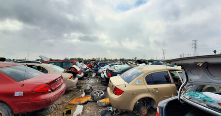 Fototapeta na wymiar A lot of broken cars at the junkyard, Houston, Texas