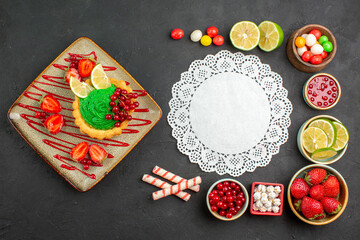 top view yummy creamy cake with fruits on a grey background dessert color biscuit sweet