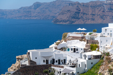 Balconies and roof tops in the village of Oia, Santorini. Architecture and landscape of Greece. Amazing panoramic view.