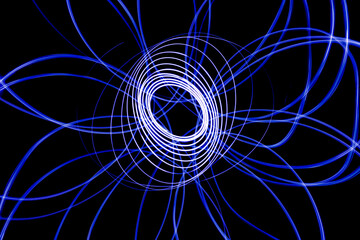 Light streaks in the shape of circles. A trace of a moving light point.