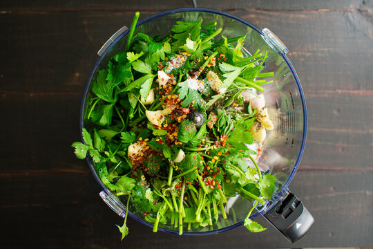 Chimichurri Ingredients In A Food Processor: Parsley, Cilantro, Garlic, And Other Chimichurri Ingredients In A Food Processor Bowl