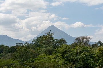 Arenal Volcano Under Puffy White Clouds in Costa Rica