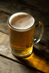 Mug of beer on dark background