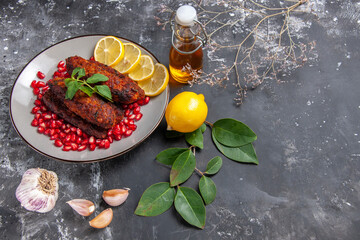 top view tasty meat cutlets with lemon slices on grey background dish photo food
