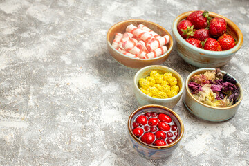 front view fresh red strawberries with candies on light background fruit berry sweet