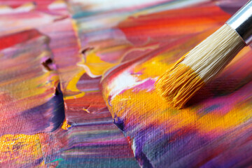 Fototapeta premium Abstract colorful paint and brush, closeup view