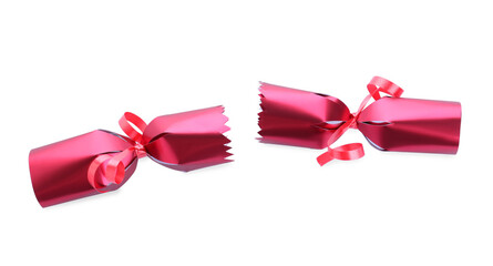 Open red Christmas cracker isolated on white, top view