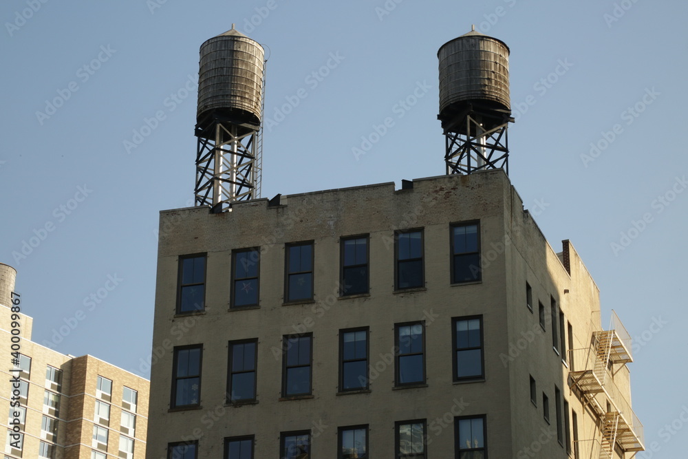 Wall mural two water towers on a roof