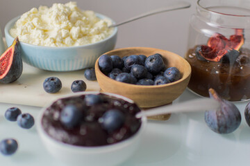 Still life of blueberries on a wooden bowl