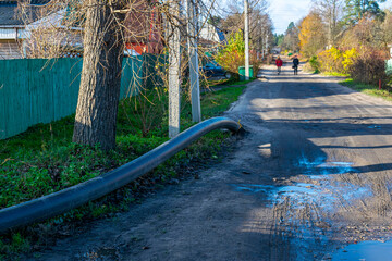A plastic gas pipe sticking out of the ground. Natural gas supply to residential buildings.