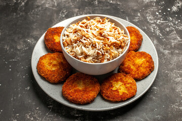 front view fried cutlets with cooked rice on dark background dish rissole meat