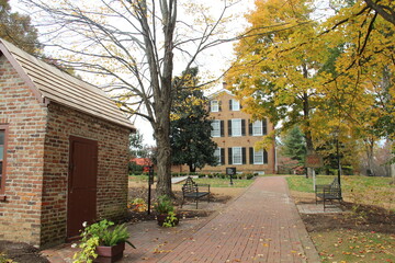 Fall tree and brick house in Kentucky.