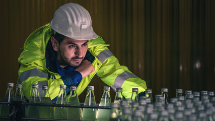 beverage factory production line engineer checking production line