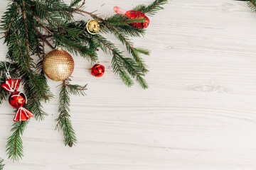 Fototapeta na wymiar Christmas Composition on a White Wooden Table with Copy Space