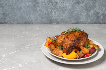 Нoliday food roast chicken or poultry with potatoes and vegetables on a white plate. dish for family dinner or lunch Christmas New Year Thanksgiving
