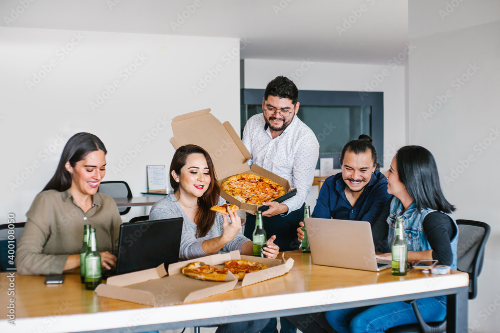 Wall mural latin people in the office hanging out drinking beer and eating pizza in mexico city