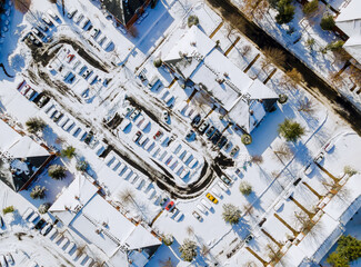 Aerial view apartment buildings complex in residential houses neighborhood roof houses covered snow