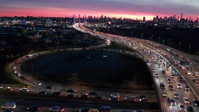 evening flying clockwise around onramp to BQE with NYC in background