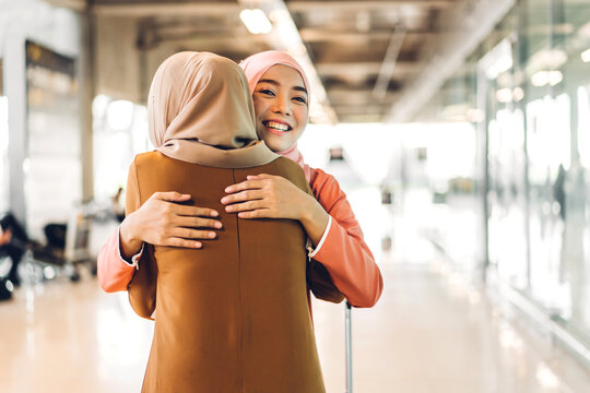 Portrait Of Happy Arabic Two Friend Muslim Woman With Hijab Dress Smiling And Hugging Together