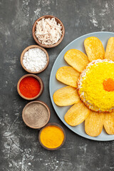top close view of salad with herbs from left side on dark background