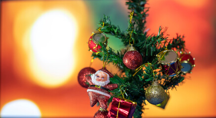 Decorated Christmas tree on blurred background. Christmas ornament hanging on the tree