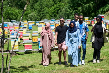 people group visiting local honey production farm