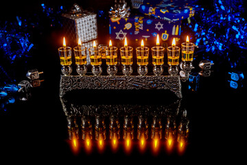 Menorah with burning candles for Hanukkah jewish holiday.