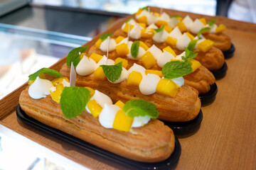 Eclair with mints, mango and cream