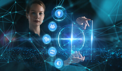 Business, Technology, Internet and network concept. Young businessman working on a virtual screen of the future and sees the inscription: Transformation
