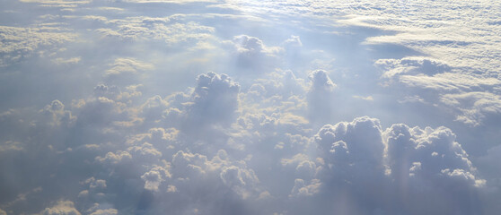 Aerial view of clouds and sky. Bird eye view from airplane window. Clouds panorama from airplane. Flight from Kiev to Sharm El Sheikh, Egypt.