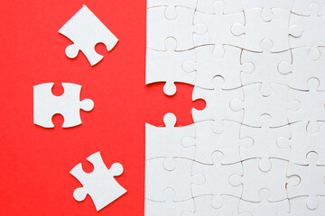 A picture of 3 jigsaw with one empty puzzle need to fit in for problem solving concept.