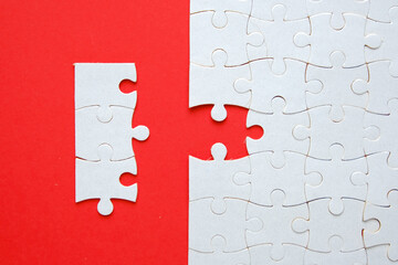 A picture of 3 jigsaw with one empty puzzle need to fit in for problem solving concept.