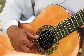 Fototapeta premium Close up image of Man playing an acoustic guitar 