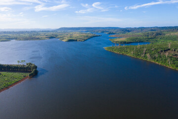 Beautiful lake nestled among rainforest in mountian at Veal Veng - Cambodia  under blue sky with white clouds. 