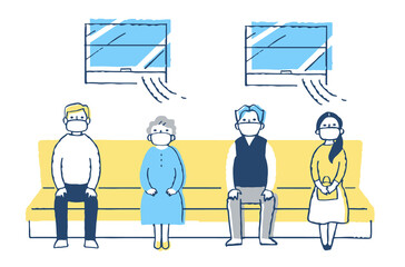 感染症予防対策　電車内で一定の間隔を空けて座る人々　