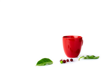 coffee beans with leaves and  empty red cup