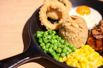 Griled chicken breast steak with  rice and onions,corns,Green peas vegetable,soft focus