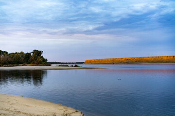 Sunset over a sandy beach on the Volga river, Russia.