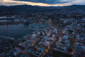 Fototapeta na wymiar Aerial panoramic view of Volos city at twilight. Magnesia - Greece.