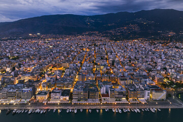 Aerial panoramic view of Volos city at twilight. Magnesia - Greece.