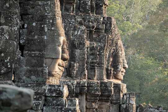 Large face carved into the wall of a temple in Angkor Thom