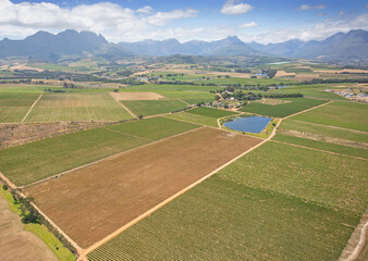 Cape Town, Western Cape / South Africa - 10/26/2020: Aerial photo of farming fields and surrounding mountains