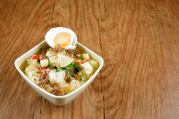 Delicious Beef soup shoot on wooden table