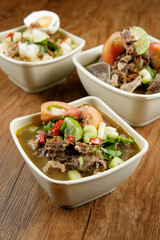 Delicious Beef soup shoot on wooden table