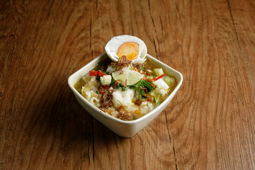 Delicious Beef soup shoot on wooden table